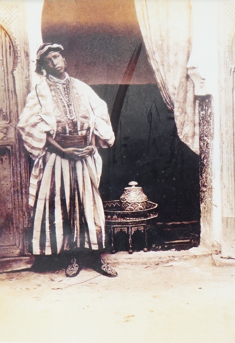 A set of four black and white photographs, Orientalist scenes to include pottery painting and a woman at a loom, 29 x 19cm, together with another
